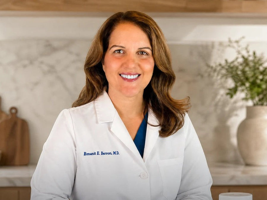 Dr. Renanit Barron, MD, in her kitchen with the DR BARRON jar